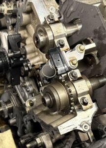 Camshaft timing components exposed during a 3.5L EcoBoost F-150 timing-system repair.