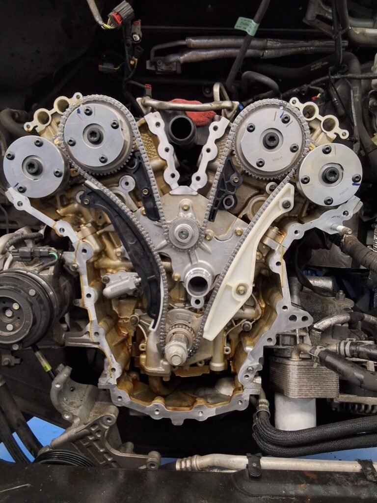 Timing chains and variable valve timing sprockets visible on a Ford Transit 3.7L V6.