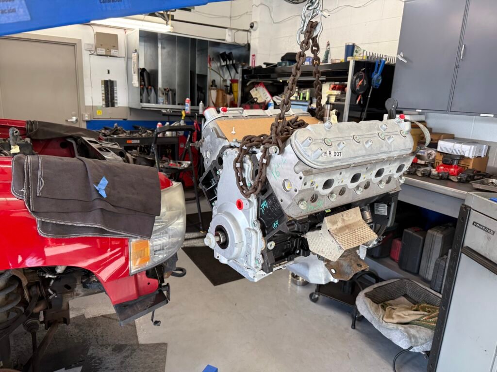 Replacement V8 long block prepared for installation in a Chevrolet Silverado.