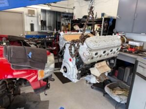 Replacement V8 long block prepared for installation in a Chevrolet Silverado.