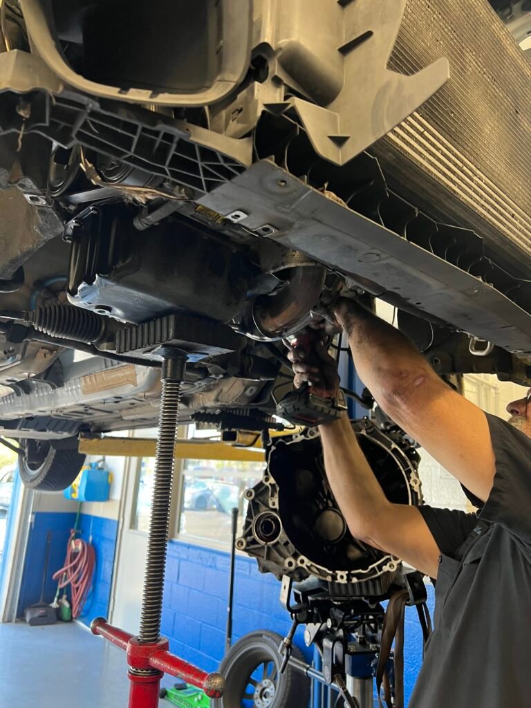 Underside of a MINI Countryman S ALL4 opened for transmission and clutch service.