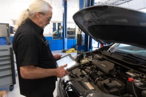 Technician diagnosing an Acura TSX with a rough running engine at Chuck’s Auto Repair Shoreline.