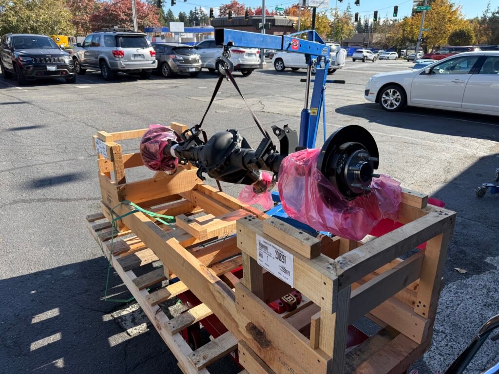 New rear axle and differential assembly prepared for installation on a Nissan Xterra at Chuck’s Auto Repair Shoreline.